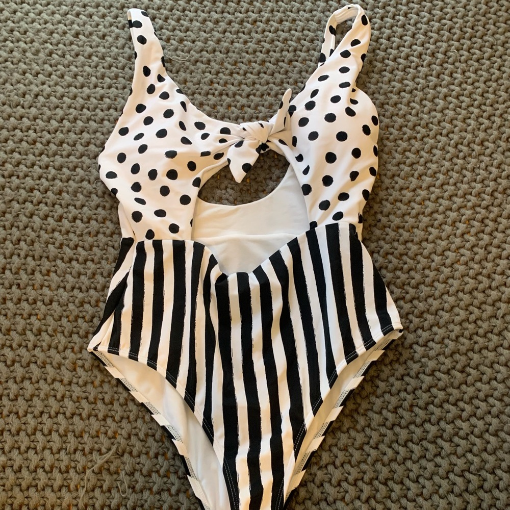 Black and white stripe and polka dot one piece bathing suit with front cut out